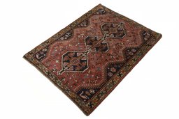 Corner detail of 2000s Shiraz rug showing border pattern and Wool pile