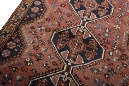 Backside of handmade 2000s Shiraz rug showing knot structure and weave density