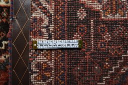 Surface texture of 2000s Shiraz rug with natural Wool and intricate pattern