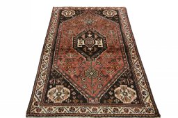 Surface texture of 2000s Shiraz rug with natural Wool and intricate pattern