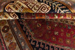 Corner detail of 2000s Shiraz rug showing border pattern and Wool pile