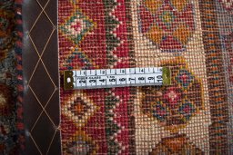 Surface texture of 2000s Shiraz rug with natural Wool and intricate pattern