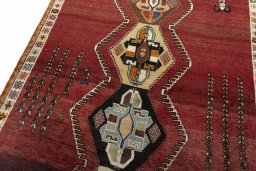 Backside of handmade 2000s Shiraz rug showing knot structure and weave density