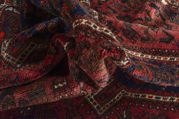 Corner detail of 2000s Shiraz rug showing border pattern and Wool pile