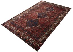 Corner detail of 2000s Shiraz rug showing border pattern and Wool pile