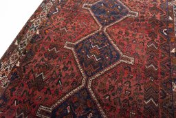 Backside of handmade 2000s Shiraz rug showing knot structure and weave density