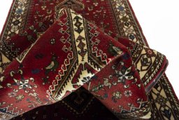 Corner detail of 2000s Shiraz rug showing border pattern and Wool pile