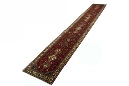 Corner detail of 2000s Shiraz rug showing border pattern and Wool pile