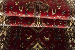 Full view of 2000s Shiraz rug from Iran / Persia, 590 × 86 cm in Red tones