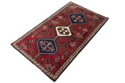 Corner detail of 2000s Shiraz rug showing border pattern and Wool pile