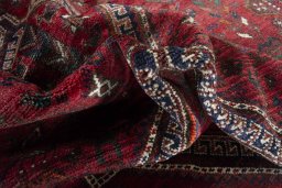 Corner detail of 2000s Shiraz rug showing border pattern and Wool pile