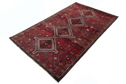 Corner detail of 2000s Shiraz rug showing border pattern and Wool pile