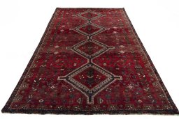 Surface texture of 2000s Shiraz rug with natural Wool and intricate pattern