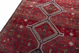Backside of handmade 2000s Shiraz rug showing knot structure and weave density