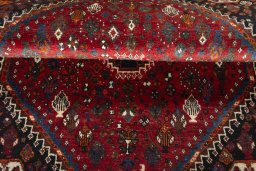 Corner detail of 2000s Shiraz rug showing border pattern and Wool pile