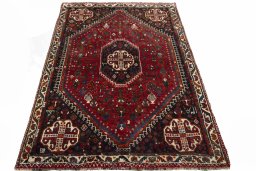 Surface texture of 2000s Shiraz rug with natural Wool and intricate pattern