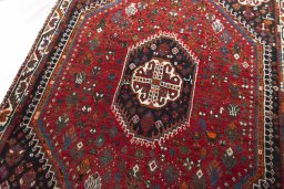 Backside of handmade 2000s Shiraz rug showing knot structure and weave density