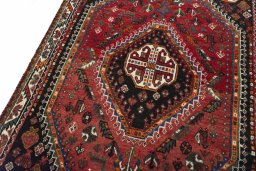 Backside of handmade 2000s Shiraz rug showing knot structure and weave density