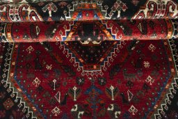 Full view of 2000s Shiraz rug from Iran / Persia, 172 × 112 cm in Red tones