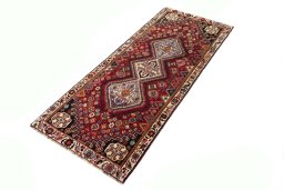 Corner detail of 2000s Shiraz rug showing border pattern and Wool pile