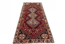 Surface texture of 2000s Shiraz rug with natural Wool and intricate pattern