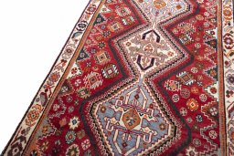 Backside of handmade 2000s Shiraz rug showing knot structure and weave density