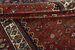 Corner detail of 2000s Shiraz rug showing border pattern and Wool pile