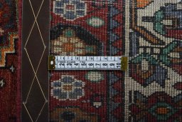Surface texture of 2000s Shiraz rug with natural Wool and intricate pattern