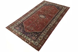 Corner detail of 2000s Shiraz rug showing border pattern and Wool pile