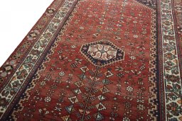 Backside of handmade 2000s Shiraz rug showing knot structure and weave density
