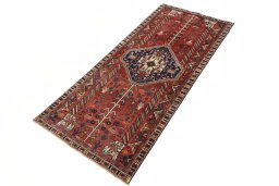 Corner detail of 2000s Shiraz rug showing border pattern and Wool pile
