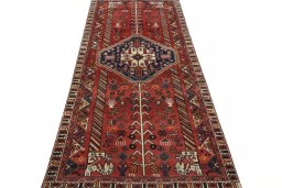 Surface texture of 2000s Shiraz rug with natural Wool and intricate pattern
