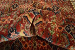 Corner detail of 2000s Shiraz rug showing border pattern and Wool pile