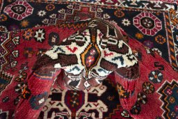 Corner detail of 2000s Shiraz rug showing border pattern and Wool pile