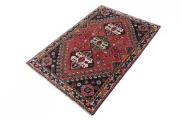Corner detail of 2000s Shiraz rug showing border pattern and Wool pile