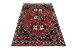 Surface texture of 2000s Shiraz rug with natural Wool and intricate pattern