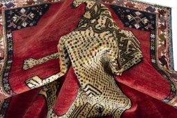 Corner detail of 2000s Shiraz rug showing border pattern and Wool pile