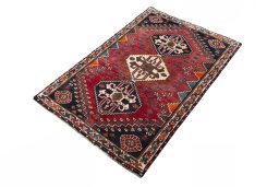 Corner detail of 2000s Shiraz rug showing border pattern and Wool pile