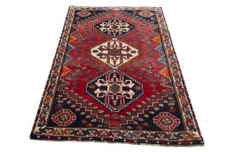 Surface texture of 2000s Shiraz rug with natural Wool and intricate pattern