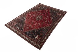 Corner detail of 2000s Shiraz rug showing border pattern and Wool pile