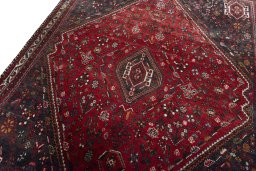 Backside of handmade 2000s Shiraz rug showing knot structure and weave density