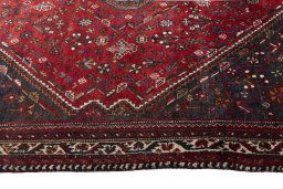 Full view of 2000s Shiraz rug from Iran / Persia, 258 × 185 cm in Red tones