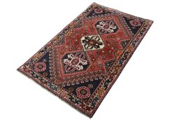 Corner detail of 2000s Shiraz rug showing border pattern and Wool pile
