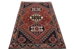 Surface texture of 2000s Shiraz rug with natural Wool and intricate pattern