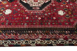 Corner detail of 2000s Shiraz rug showing border pattern and Wool pile