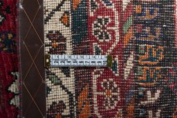 Backside of handmade 2000s Shiraz rug showing knot structure and weave density