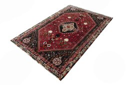 Corner detail of 2000s Shiraz rug showing border pattern and Wool pile