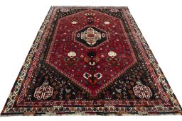 Surface texture of 2000s Shiraz rug with natural Wool and intricate pattern