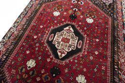 Backside of handmade 2000s Shiraz rug showing knot structure and weave density