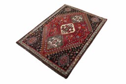 Corner detail of 2000s Shiraz rug showing border pattern and Wool pile